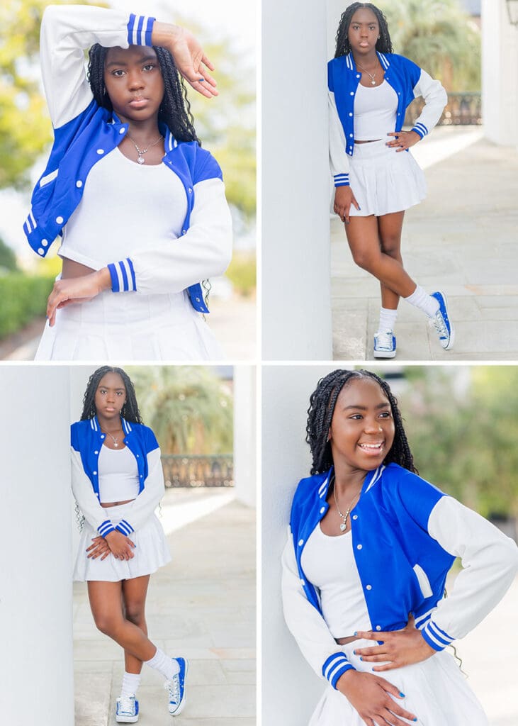 Aris posing in her blue varsity jacket and white skirt near white columns.