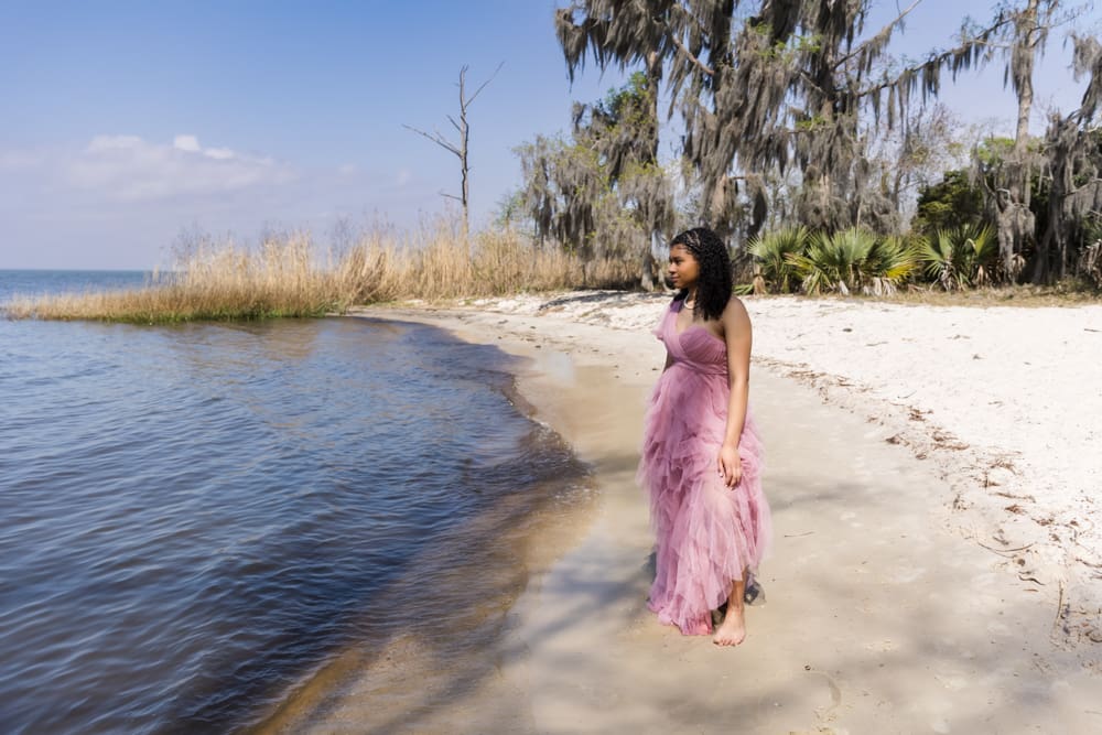 Teen girl smiling during golden birthday portrait session