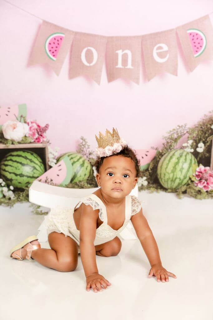 little girl turning one with a watermelon themed photo shoot in the studio
