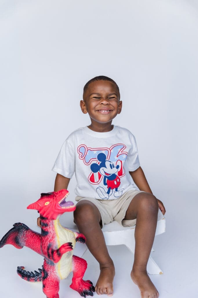 Baton Rouge Children's Photographer taking picture of toddler boy and his favorite toy